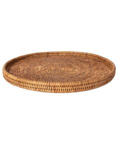 a round wicker tray with an intricate design on the bottom and sides, set against a white background