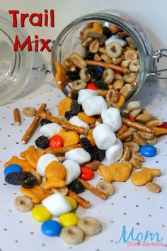 trail mix in a glass jar on a table