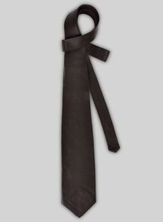 Dark Brown Leather Tie 
 
Made Using Pure Napa Sheep Skin Soft Leather.  Make a great impression with our trendy and stylish slim leather tie, Ideal for both dress or casual wear. 
 
A must have for your neckwear collection that you won't find anywhere else. Italian Suit, Leather Tie, Sheep Skin, Wool Suit, Dark Brown Leather, Fabric Samples, Wedding Suits, Soft Leather, Luxury Branding