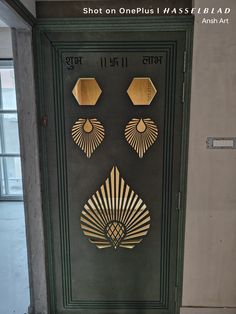 an art deco door with gold designs on the front and side panels that are cut out to look like fanciful fans