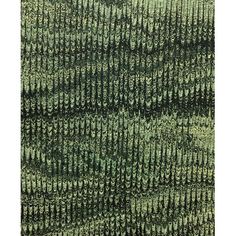 an area rug with green and black patterns