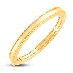 A lustrous high-polish center band is bordered above and below by dynamic milgrain trim in this exciting children's solid bangle bracelet 18K Yellow Gold The 4.0mm bangle bracelet secures with a fancy clasp Classic Bracelets With Decorative Band As Gift, Classic Formal Bracelets With Decorative Band, Classic Bracelets With Decorative Band For Formal Occasions, Classic Gold Jewelry With Fluted Bezel, Yellow Gold Bangle Bracelet With Decorative Band, Yellow Gold Bangle With Decorative Band, Elegant Yellow Gold Bracelet With Decorative Band, Classic Gold Bangle With Shiny Finish, Classic 14k Gold Bangle With Shiny Finish