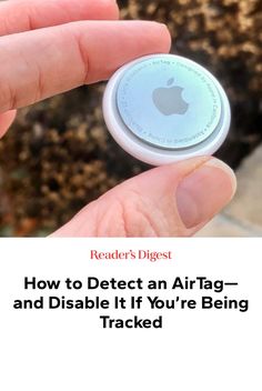 a hand holding an air tag with the text how to defect an air tag and disable it if you're being tracked