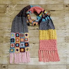 two scarves with the words eveline scarf written in pink, yellow and blue