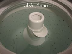 a close up of a washing machine with the lid down