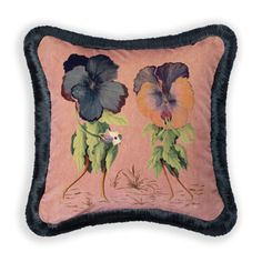 an embroidered pillow with two flowers on the front and one flower on the back,