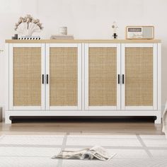 a white cabinet with wicker doors in a room