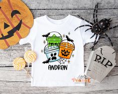 Our adorable Personalized Halloween Shirt for Boys is the perfect addition to your kids holiday wardrobe. The shirt features a halloween bucket design that is perfect for trick or treating, costume parties, or just for a fun, festive day at school. You can personalize the shirt with your son's name making it a truly unique piece. It's soft, comfortable, and made of high-quality materials - he'll love showing off his Halloween spirit all October long! Personalized Halloween Bucket Shirt - Boys Halloween Shirt - Retro Kids Halloween Tee - Pumpkin Shirt - Toddler Halloween - Halloween Outfit ► SHIRT DETAILS: ☆ We use 100% cotton shirts and bodysuits ☆ Short Sleeve Shirts ☆ Shirts and bodysuits run true to size ☆ Design is printed directly to the shirt using a commercial Direct to Garment prin Personalized Halloween Bucket, Halloween Shirts For Boys, Halloween Buckets, Retro Kids, Handmade Boutique, Toddler Halloween, Halloween Boys, Pumpkin Shirt, Halloween Tees