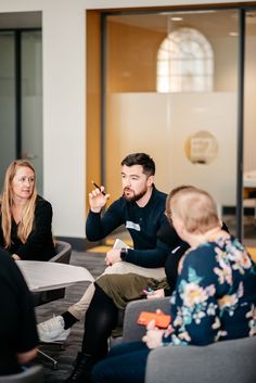 Corporate event with teams in a breakout area Corporate Events Photography, Corporate Office Photoshoot, Company Photoshoot Ideas Fun, Office Team Photoshoot, Office Photoshoot Ideas Group, Corporate Photoshoot Ideas, Creative Team Photography