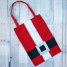 a santa claus bag sitting on top of a wooden table