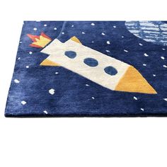 a rug with a rocket ship on it