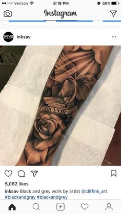 a person with a black and grey tattoo on their arm that has an image of a rose