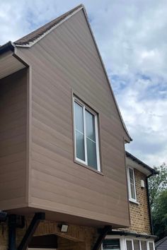 Home exterior with modern walnut brown composite cladding, offering a durable, low-maintenance solution that resists weathering and decay. Cladding Ideas, Wooden Cladding, Composite Cladding, The Porch, Country Home, Low Maintenance, Curb Appeal, Rustic Charm, Country House