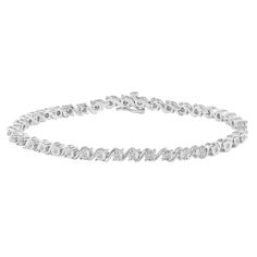 Showcasing a shimmering collection of round diamonds weighing 0.33ct tw in Miracle plates, this 7 inches long Sterling Silver bracelet is a dazzling gift to your loved one. Cut, Color, Clarity, and Carat Weight Cut: Very Good Color: I-J Clarity: I2-I3 Total diamond weight: 1/3Ctw Stone Characteristics Type: Diamond Treatment: Genuine Diamond Source: Natural Mined Diamonds Total number of stones: 40 Stone shape: Round Stone enhanced: No Metal Characteristics Metal: Sterling Silver Solid Metal: Ye Luxury Jewellery, Diamond Tennis Bracelet, Tennis Bracelet Diamond, 3 Carat, Stud Earrings Set, Sterling Silver Bracelet, Solid Metal, Conflict Free Diamonds, Tennis Bracelet