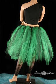 "Black & Green Adult Tutu tulle skirt Streamer style midi knee length with bustle back made in All Sizes XS - Plus size - This tutu skirt is fuller then our normal knee length tutus. This skirt is handmade from a single layer of 100yards worth of 6\" strips of tulle in green and black Bridal tulle. We then add another 50yards of Black and green tulle at 26\" long off the back, creating this high low design. All tulle is tightly machine gathered, sewn and sergered to the black fabric covered Halloween Party Tulle Petticoat, Halloween Fitted Tulle Skirt, Fitted Tulle Skirt For Halloween, Halloween Dance Tulle Skirt, Halloween Stretch Tulle Petticoat, Halloween Fitted Tulle Petticoat, Halloween Tulle Petticoat, Stretch Tulle Petticoat For Halloween, Stretch Petticoat For Halloween Costumes