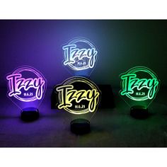 three different colored light up signs with the word taco on them in various colors