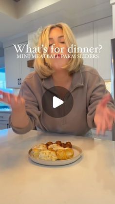 a woman sitting at a table with food in front of her and the words what's for dinner?