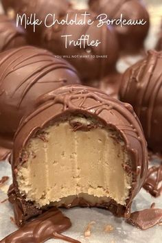 chocolate covered truffles with one cut in half