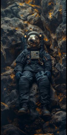 an astronaut is sleeping on some rocks