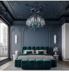 an elegant bedroom with blue walls, chandelier and green velvet bed in the middle