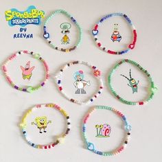 six bracelets with cartoon characters on them are arranged in the shape of circle frames