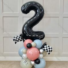 the number two balloon arrangement is ready to be used for an event or birthday party