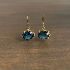 Rich in color with breathtaking sparkle, these London blue topaz ovals are perfectly poised in classic yellow gold. 

18k gold setting, 14k French ear wire 
Topaz 10mm x 8mm (3/8" x 5/16") 
Earrings hang 7/8" from the ear 
Each earring weighs 1.3ghttps://www.meekajewelry.com/collections/november-sparkle/products/small-faceted-oval-london-blue-topaz-earrings Cushion Cut Aquamarine Ring, Matchstick Earrings, London Blue Topaz Earrings, Tahitian Pearl Pendant, Emerald Cut Rings, Blue Topaz Earrings, Topaz Earrings, Blue Quartz