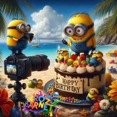 a birthday cake with two minion characters and a camera in front of the beach