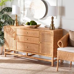 a living room with wicker furniture and potted plants on the sideboard next to it