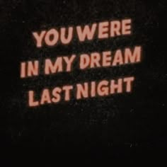 the words you were in my dream last night are lit up against a black background