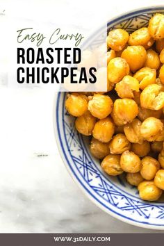 roasted chickpeas in a blue and white bowl with text overlay that reads easy curry roasted chick peas