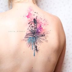 a woman with a book tattoo on her back