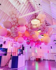 a room with balloons hanging from the ceiling