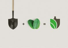 two shovels, one with green leaves and the other with a brown handle are shown next to each other