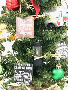 a christmas tree decorated with ornaments and signs