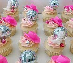 cupcakes decorated with pink and silver decorations