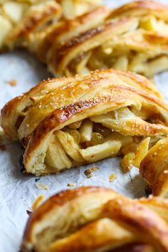 several pieces of apple pie sitting on top of a piece of paper