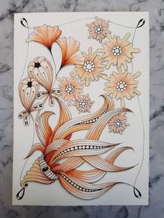 an artistically designed card with flowers and swirls in orange, yellow and white