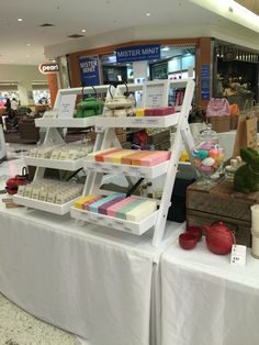 there are many different items on display at the store together, including soaps and other things