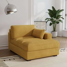 a living room with a yellow chair and potted plant on the floor next to it