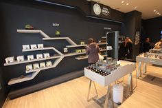 a woman standing in front of a store display