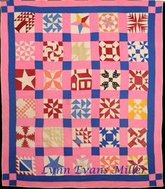 a pink and blue quilt with many different designs on the front, along with an inscription that reads lynn evans miller