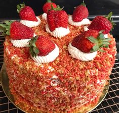 there is a cake with strawberries on top