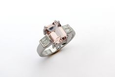 "This luxurious engagement ring is hard to ignore! It has a beautiful combination of colors and shapes, made with premium quality materials, designed in clean precise geometric lines, and has a lot of presence and beauty. The contrast between the pink Morganite and the clear diamonds is eye-catching and impressive. Get this art deco engagement ring for the woman who has your heart and she will say \"yes!\" and wear this elegant engagement ring every day for the rest of her life! ✿ Item details ✿ Modern Octagon Ring With Accent Stones, Modern Octagon Rings With Accent Stones, Modern Rings With Octagon Center Stone, Modern Octagon Rings With Center Stone, Modern Baguette Cut Rings With Accent Stones, Modern Platinum Rings With Baguette Diamonds, Modern Platinum Baguette-cut Ring, Modern Platinum Baguette Cut Wedding Ring, Modern Platinum Baguette Cut Ring