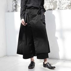 Length: Ankle-Length Pants Material: COTTON Pattern Type: Solid Style: Streetwear Pant Style: Wide Leg Pants Closure Type: Elastic Waist Front Style: Flat Waist Type: High Gender: Women Fabric Type: Jersey Fit Type: REGULAR Decoration: Button Black High-waisted Harem Pants For Work, Black Wide Leg Pants With Belt Loops For Spring, Black Ankle-length Wide Leg Pants With Belt Loops, Black Wide-leg Harem Pants For Work, Long Wrap Skirt, Unique Pants, Skirt Pant, Streetwear Fits, Japanese Street Fashion