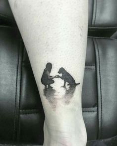 a person with a dog tattoo on their leg