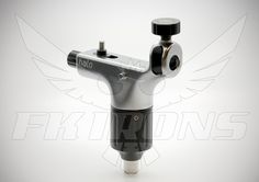 a silver and black tattoo machine on a white background