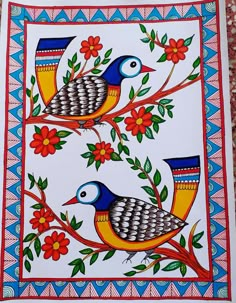 two colorful birds sitting on top of a tree branch