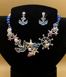 "Multicolor sea life bib statement necklace & earring set featuring starfish, shells and anchors.  This is the perfect beach, summer or tropical cruise jewelry.  Optional matching bracelet available.  Each piece has a custom length to fit all sizes.  Necklace is made from glass pearls and crystals to form a unique and stylish look.  I can convert any of the earrings from pierced to clip on style at no charge, please request this in notes with purchase.  Please do not hesitate to contact me with Cruise Jewelry, L Post, Tropical Cruise, Matching Bracelet, Necklace And Earring Set, Matching Bracelets, Beach Summer, Necklace Earring Set, Anchors