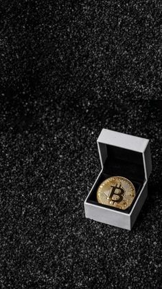 a bitcoin in a box on the ground